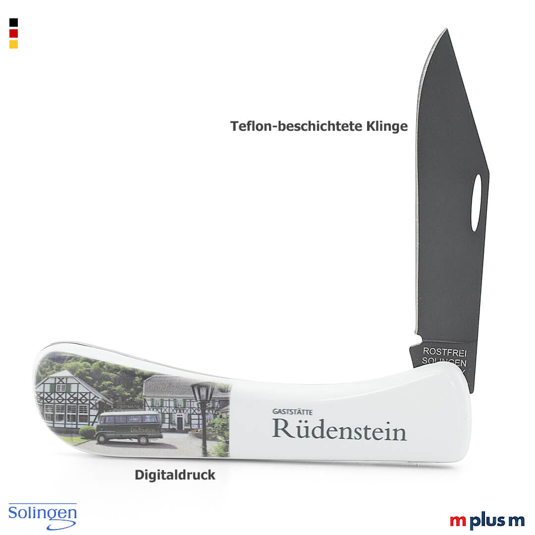 Klappmesser mit Metallklinge und weißem Griff in Seitenansicht geöffnet mit dunkler Klinge und Motivfläche